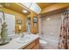 Cozy bathroom featuring a single sink vanity with a shower/tub combo and neutral tile at 13238 Asbury St, Spring Hill, FL 34609