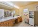 Bathroom with a double sink vanity and a glass door shower at 13238 Asbury St, Spring Hill, FL 34609