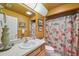 Cozy bathroom with a shower featuring a vibrant sea-themed shower curtain and a single sink vanity at 13238 Asbury St, Spring Hill, FL 34609