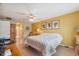 Bright bedroom with a ceiling fan and hardwood floors at 13238 Asbury St, Spring Hill, FL 34609