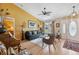 Bright and inviting living room with hardwood floors, large windows, and comfortable seating at 13238 Asbury St, Spring Hill, FL 34609