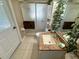 Bathroom with a shower, single sink, and decorative plant accents at 13807 Eagles Rock Ct, Hudson, FL 34667