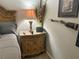 Detailed bedside table with lamp and decorations, complementing the bedroom's style at 13807 Eagles Rock Ct, Hudson, FL 34667
