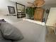 Cozy bedroom featuring unique decorations, including an ornate mirror and accent lighting at 13807 Eagles Rock Ct, Hudson, FL 34667