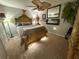 Bedroom features a bed with a detailed headboard, ceiling fan, and neutral decor at 13807 Eagles Rock Ct, Hudson, FL 34667