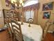 Formal dining room with hardwood floors, elegant furnishings, and a chandelier at 13807 Eagles Rock Ct, Hudson, FL 34667