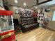 Home movie theater room featuring comfortable seating, wall decor, and a vintage popcorn machine at 13807 Eagles Rock Ct, Hudson, FL 34667