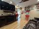 A home theater with entertainment center, a vintage popcorn machine and decorative wall items at 13807 Eagles Rock Ct, Hudson, FL 34667