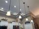 Kitchen lighting features pendant lights, recessed lights, and trim lighting at 13807 Eagles Rock Ct, Hudson, FL 34667