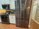 Kitchen featuring stainless steel refrigerator and appliances with granite counters at 13807 Eagles Rock Ct, Hudson, FL 34667