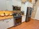Kitchen featuring stainless steel appliances, including a refrigerator and oven at 13807 Eagles Rock Ct, Hudson, FL 34667