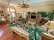 Open-concept living space features hardwood flooring and lots of natural light at 13807 Eagles Rock Ct, Hudson, FL 34667