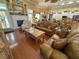 Inviting living room with hardwood floors, fireplace, and comfortable seating arrangement at 13807 Eagles Rock Ct, Hudson, FL 34667