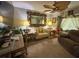 Inviting living room with plush seating, decorative lamps, and a large framed mirror at 13807 Eagles Rock Ct, Hudson, FL 34667