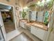 Bathroom with double sink vanity and granite countertop at 13807 Eagles Rock Ct, Hudson, FL 34667