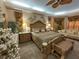 Spacious main bedroom with tray ceilings, sitting area, ceiling fan and carpet at 13807 Eagles Rock Ct, Hudson, FL 34667