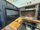 Open stainless steel microwave above granite countertop and stove at 13807 Eagles Rock Ct, Hudson, FL 34667