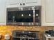 Close up of stainless steel microwave with modern features and design at 13807 Eagles Rock Ct, Hudson, FL 34667