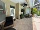 Covered lanai with outdoor seating, ceiling fan and access to the pool at 13807 Eagles Rock Ct, Hudson, FL 34667