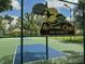 Autumn Oaks community pickle ball court behind metal fence at 13807 Eagles Rock Ct, Hudson, FL 34667