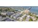 Stunning aerial view of the neighborhood with nearby waterfront and multiple condo buildings at 147 Bluff View Dr # 105, Belleair Bluffs, FL 33770