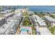 Aerial view of multi-story building with community pool at 147 Bluff View Dr # 105, Belleair Bluffs, FL 33770