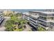 Multi-story building with mature landscaping and parking at 147 Bluff View Dr # 105, Belleair Bluffs, FL 33770