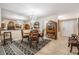 Dining room with a round table, a decorative rug, and a large mirror at 147 Bluff View Dr # 105, Belleair Bluffs, FL 33770