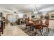 Open-concept living and dining area with neutral tones and ample natural light at 147 Bluff View Dr # 105, Belleair Bluffs, FL 33770