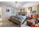 Bright main bedroom with a comfortable bed, decorative accents, and natural lighting at 147 Bluff View Dr # 105, Belleair Bluffs, FL 33770