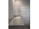 Modern bathroom with a patterned countertop and sink at 15591 Charmwood Dr, Hudson, FL 34667