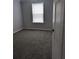 Bedroom with neutral walls and carpet with a window and blinds at 15591 Charmwood Dr, Hudson, FL 34667