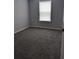 Bedroom with neutral walls and carpet and a window with blinds at 15591 Charmwood Dr, Hudson, FL 34667