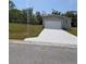 Charming single-Gathering home with a pristine driveway and an attached single car garage at 15591 Charmwood Dr, Hudson, FL 34667