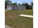 Charming single-story home featuring a garage, well-maintained lawn, and pleasant landscaping at 15591 Charmwood Dr, Hudson, FL 34667