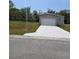 Charming single-Gathering home with a pristine driveway and an attached single car garage at 15591 Charmwood Dr, Hudson, FL 34667