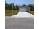 Charming single-Gathering home with a pristine driveway and an attached single car garage at 15591 Charmwood Dr, Hudson, FL 34667