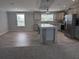 Bright open kitchen with stainless steel appliances, an island, and tiled backsplash at 15591 Charmwood Dr, Hudson, FL 34667