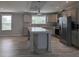 Open kitchen featuring stainless steel appliances, an island, and tiled backsplash at 15591 Charmwood Dr, Hudson, FL 34667