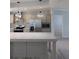 Modern kitchen featuring stainless steel refrigerator, built-in microwave, and large kitchen island at 15591 Charmwood Dr, Hudson, FL 34667