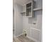 Laundry room with shelving and washing machine hookups at 15591 Charmwood Dr, Hudson, FL 34667