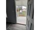 View from inside to the patio, which is fenced and has a view of the backyard at 15591 Charmwood Dr, Hudson, FL 34667