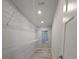Walk-in closet with wire shelving and wood-look flooring at 15591 Charmwood Dr, Hudson, FL 34667