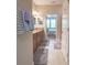 Hallway shot leading to bathroom with double vanity and bedroom in view at 1669 Ludington Ave, Wesley Chapel, FL 33543
