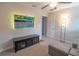 Cozy bedroom featuring a TV, mounted on the wall, and a loveseat couch at 1669 Ludington Ave, Wesley Chapel, FL 33543