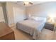 Bedroom with a plush queen bed, bedside tables with lamps, and a wood dresser at 1669 Ludington Ave, Wesley Chapel, FL 33543