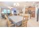 Open-concept space with kitchen, dining area, and living room featuring lots of natural light at 1669 Ludington Ave, Wesley Chapel, FL 33543