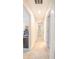 Bright hallway featuring multiple doorways and access to various rooms in the house at 1669 Ludington Ave, Wesley Chapel, FL 33543
