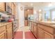 Well-equipped kitchen with stainless steel appliances, light wood cabinets, and granite countertops at 1669 Ludington Ave, Wesley Chapel, FL 33543