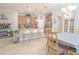 Spacious kitchen with a breakfast bar, stainless appliances, and a dining area with access to backyard at 1669 Ludington Ave, Wesley Chapel, FL 33543